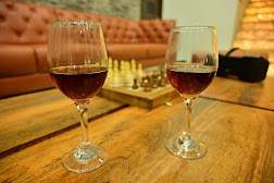 Cozy indoor lounge with chess set and leather seating